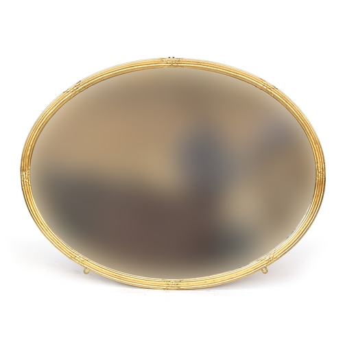 329 - A large decorative oval gilt framed mirror, with bevelled glass, 128x97cm