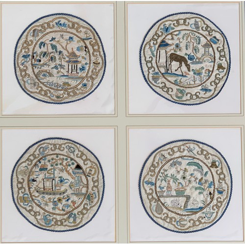 264 - A set of four framed 19th century Chinese silk needlework roundels, depicting garden scenes with pag... 