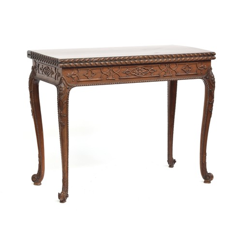 396 - An 18th century mahogany card table, the foldover top with gadrooned edge, over a blind fretwork fri... 