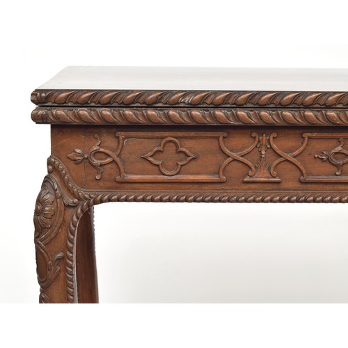 396 - An 18th century mahogany card table, the foldover top with gadrooned edge, over a blind fretwork fri... 