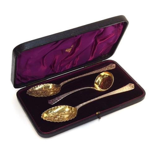 180 - A cased pair of late Victorian silver berry spoons, and sugar sifter by Elkington & Co Ltd, Birmingh... 