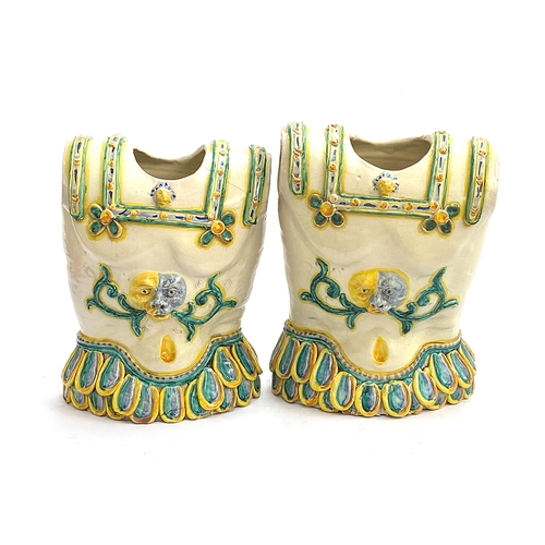 105 - A pair of Italian Caltagirone majolica jardinieres in the form of breastplates, in Renaissance style... 