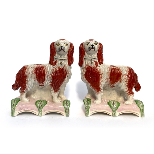 108 - A pair of decorative modern Staffordshire spaniels, 25cmH