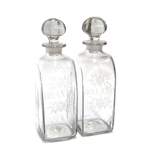 121 - A pair of Georgian engraved glass decanters, 'Brandy' and  'Hollands', each 25cmH