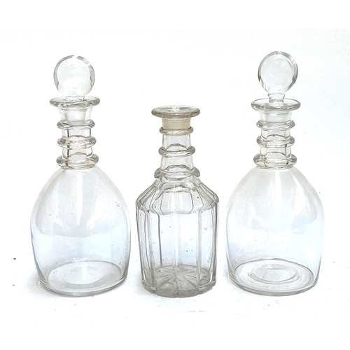 136 - A pair of 19th century decanters with annulated collars, 26cmH; together with a further cut glass de... 