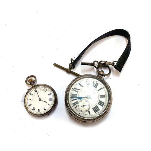 57 - A large 925 silver open faced pocket watch, AF, 52mm diameter; together with a smaller silver pocket... 