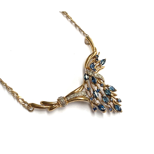 7 - A 9ct gold necklace with central floral spray pendant set with diamonds and marquise cut sapphires, ... 