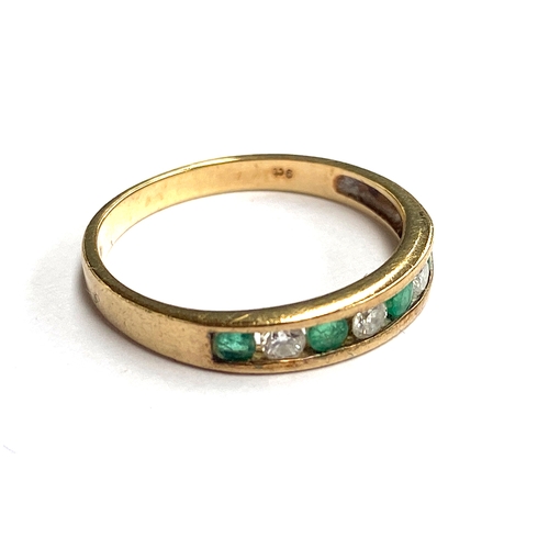 10 - A 9ct gold, diamond and emerald ring, size N, 1.6g