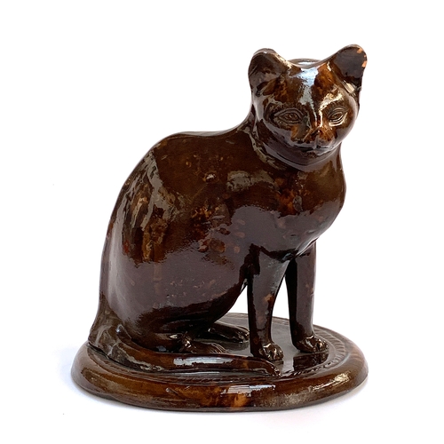 66 - A 19th century treacle glazed earthenware figure of a cat, possibly Canney Hill Pottery, 29cmH