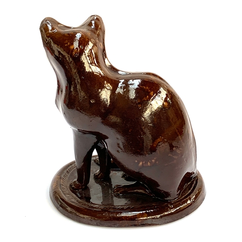 66 - A 19th century treacle glazed earthenware figure of a cat, possibly Canney Hill Pottery, 29cmH