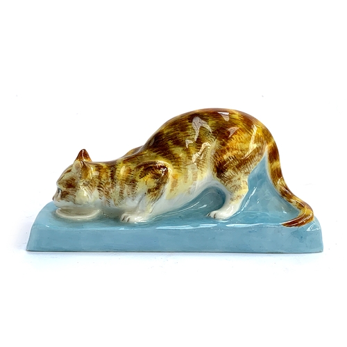 97 - Stella Crofts (1898-1964), Cat Eating, a Royal Worcester figure, model no.2897, glazed in colours, p... 