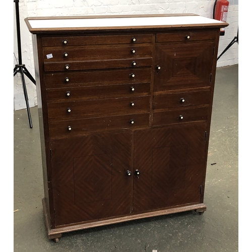 881 - An 20th century mahogany and formica dentist's or specimen cabinet, with white formica top over an a... 