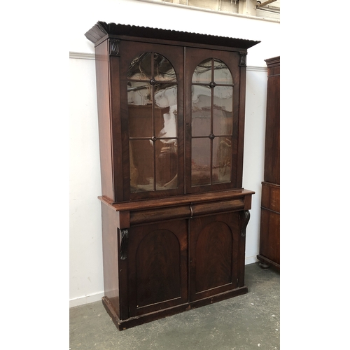 870 - A Victorian glazed library bookcase the base with two drawers over domed panel drawers, 120x48x210cm... 