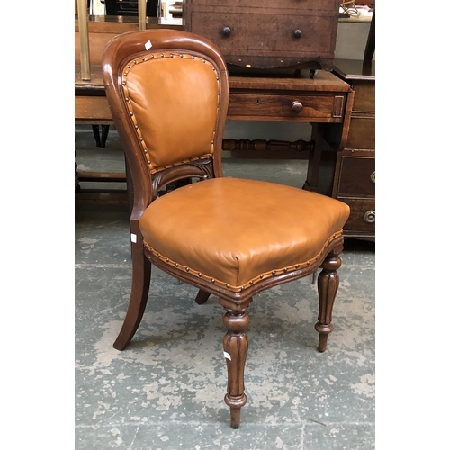 794 - An Edwardian mahogany oval open armchair, together with a leather upholstered Victorian balloon back... 