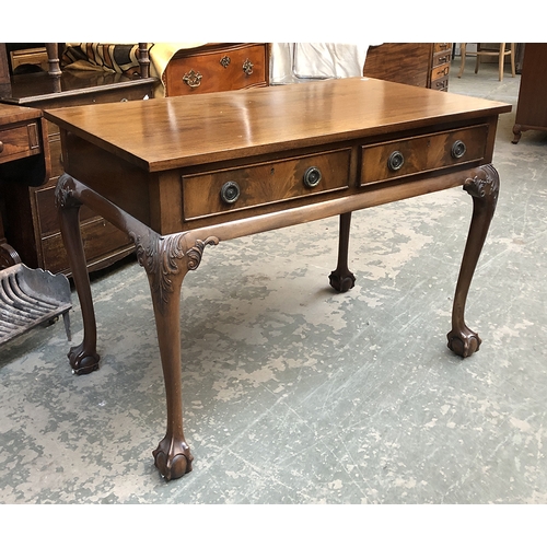 798 - A mahogany side table in 18th century style, with two drawers on cabriole legs with ball and claw fe... 