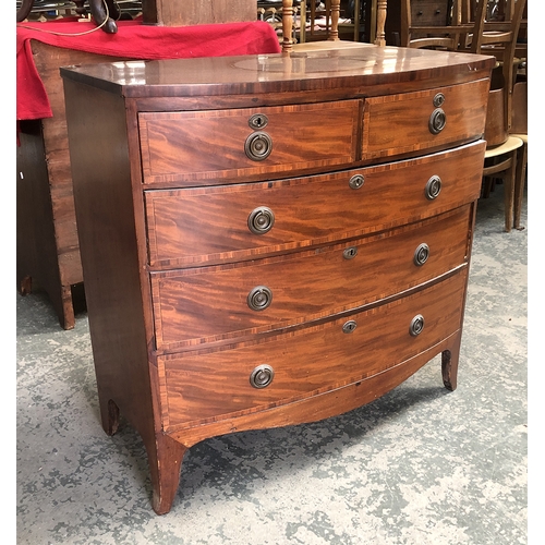 813 - A Regency mahogany bowfront chest of two short over three graduating drawers on swept bracket feet, ... 