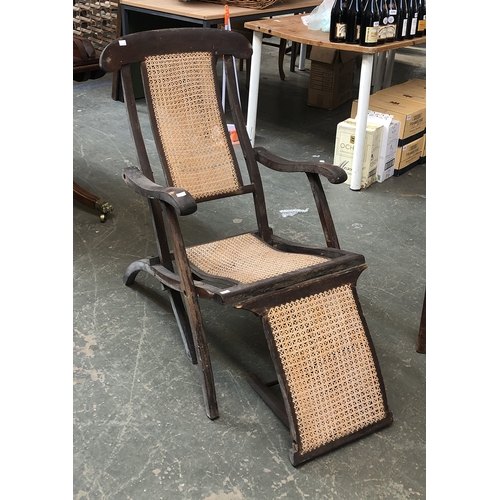 841 - A caned plantation style lounge chair