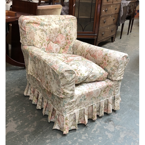 851 - An early 20th century armchair with feather filled cushion and floral covers, 81cmW