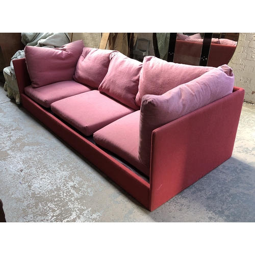 856 - A very large contemporary red three-seater sofa with loose cushions, 250x102x66cmH