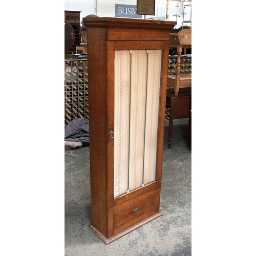 857 - A 19th century oak gun cabinet with glazed door and single drawer below, 61x25x156cmH