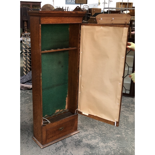 857 - A 19th century oak gun cabinet with glazed door and single drawer below, 61x25x156cmH