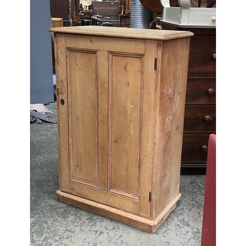 812 - A 19th century pine cabinet with single panelled door, 70x40x106cmH