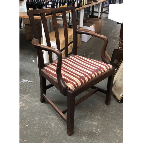 834 - A mahogany open armchair with stuffover seat and H stretcher