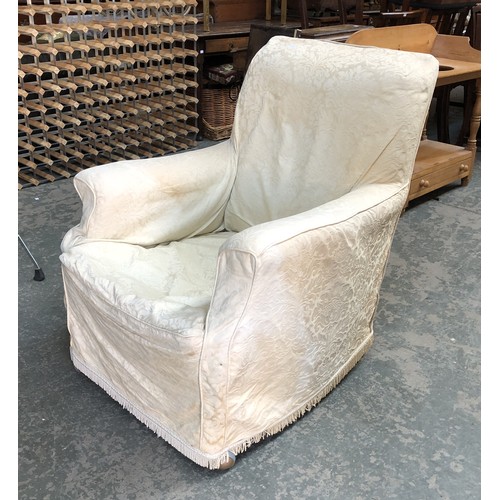 853 - A 19th century armchair with loose cover on square tapered legs and later casters, 74cmW