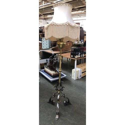 840 - A very heavy good quality brass and polished steel adjustable standard lamp, converted for electrici... 