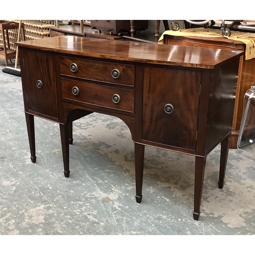 831 - A mahogany bowfront sideboard in George III style, with two drawers flanked by cupboards, 136cmW