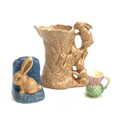 135 - Three pieces of 1930s Sylvac: a bunny jug, 21.5cmH, bunny bookend and small Thistle jug