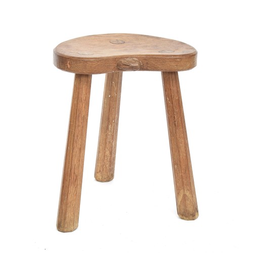 448 - Peter 'Rabbitman' Heap (ex-Mouseman), an oak stool, on three splayed octagonal legs, the dished kidn... 