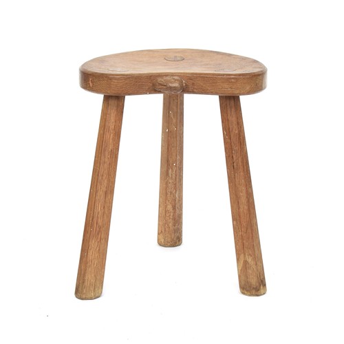 448 - Peter 'Rabbitman' Heap (ex-Mouseman), an oak stool, on three splayed octagonal legs, the dished kidn... 