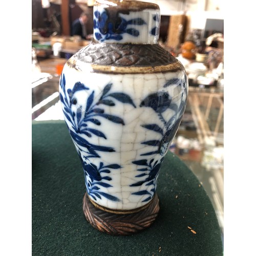 111 - Three Chinese blue and white crackle glaze lidded vases, two covers AF; together with a small matchi... 