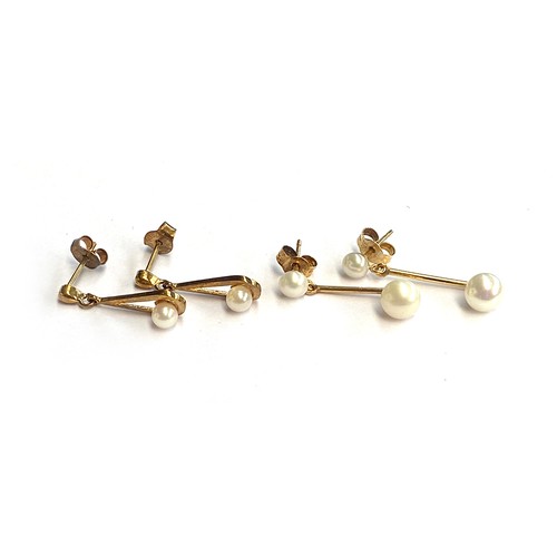 12 - A pair of 9ct gold and pearl teardrop shaped earrings, together with a further pair of yellow metal ... 