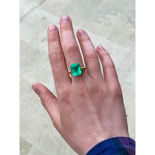 123 - A Kat Florence 18ct gold, emerald and diamond ring, the Muzo Colombian emerald 9.69cts and measuring... 