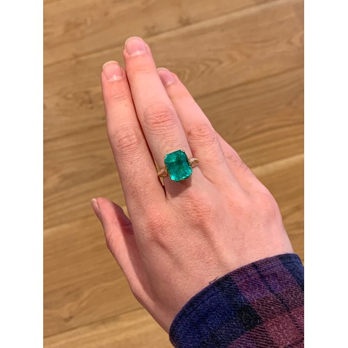 123 - A Kat Florence 18ct gold, emerald and diamond ring, the Muzo Colombian emerald 9.69cts and measuring... 