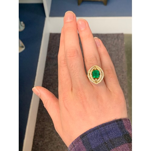 125 - A Kat Florence 18ct yellow gold, diamond and emerald ring of navette form, the Russian emerald 2.97c... 