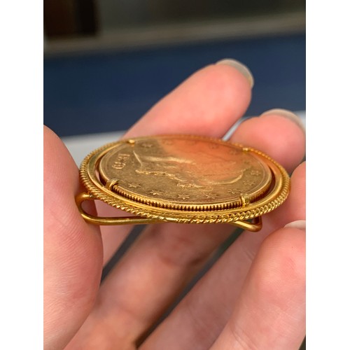 147 - A US twenty dollars, 1879, .900 gold, approx. 33.4g,  in a gold money clip, tests as 14ct or higher,... 