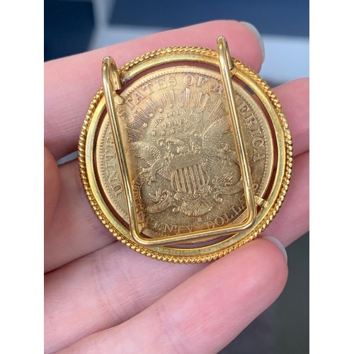 147 - A US twenty dollars, 1879, .900 gold, approx. 33.4g,  in a gold money clip, tests as 14ct or higher,... 