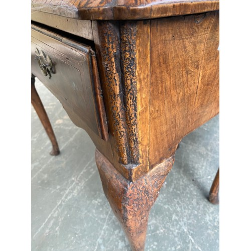 374 - A George II walnut and cross-banded lowboy, the quarter veneered top over single drawer, on cabriole... 