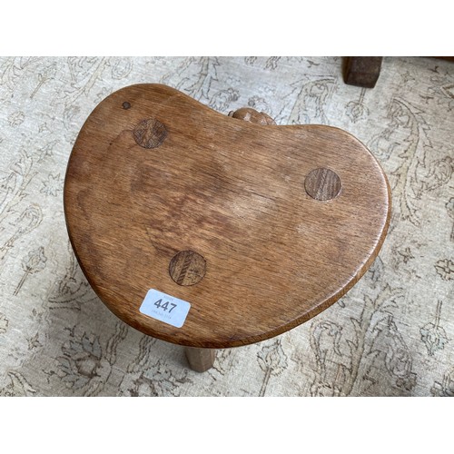 448 - Peter 'Rabbitman' Heap (ex-Mouseman), an oak stool, on three splayed octagonal legs, the dished kidn... 