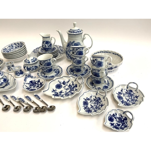 2065 - A quantity of Bohemia Zwiebelmuster Czech blue and white dinner ware, to include coffee pot, graduat... 