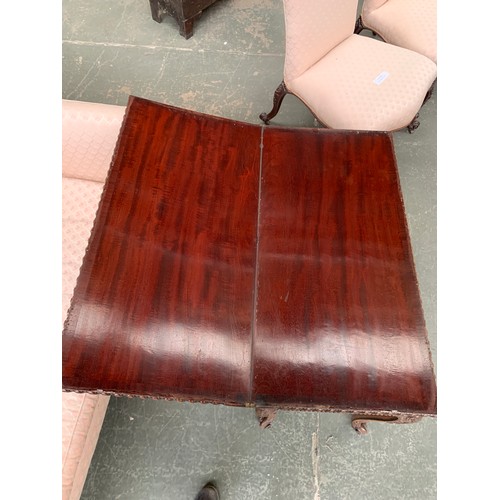 396 - An 18th century mahogany card table, the foldover top with gadrooned edge, over a blind fretwork fri... 