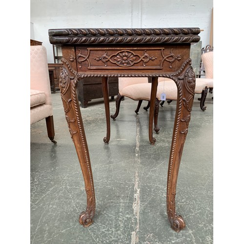 396 - An 18th century mahogany card table, the foldover top with gadrooned edge, over a blind fretwork fri... 