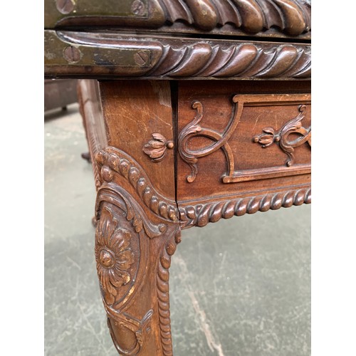 396 - An 18th century mahogany card table, the foldover top with gadrooned edge, over a blind fretwork fri... 