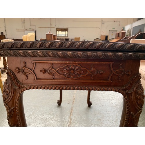 396 - An 18th century mahogany card table, the foldover top with gadrooned edge, over a blind fretwork fri... 