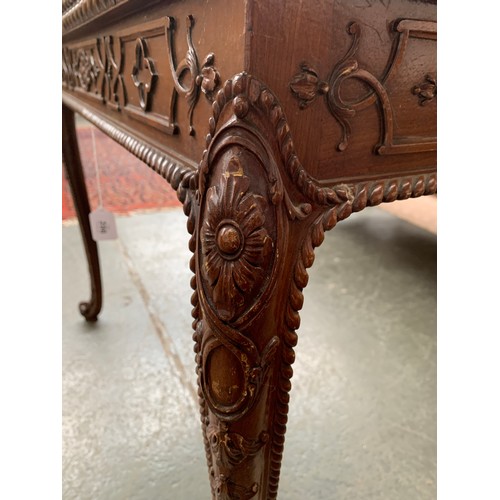 396 - An 18th century mahogany card table, the foldover top with gadrooned edge, over a blind fretwork fri... 