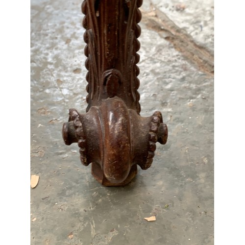 396 - An 18th century mahogany card table, the foldover top with gadrooned edge, over a blind fretwork fri... 