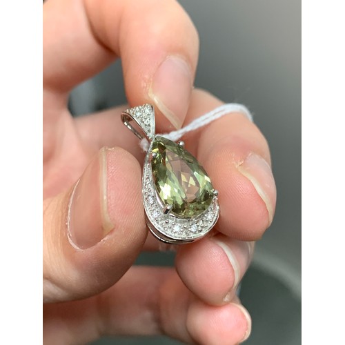 89 - An 18ct white gold, zultanite and diamond pendant, the pear cut zultanite 4.5cts and measuring 15x9m... 